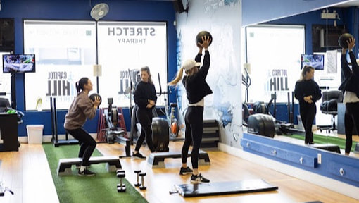 A small group class training with medicine balls in the studio